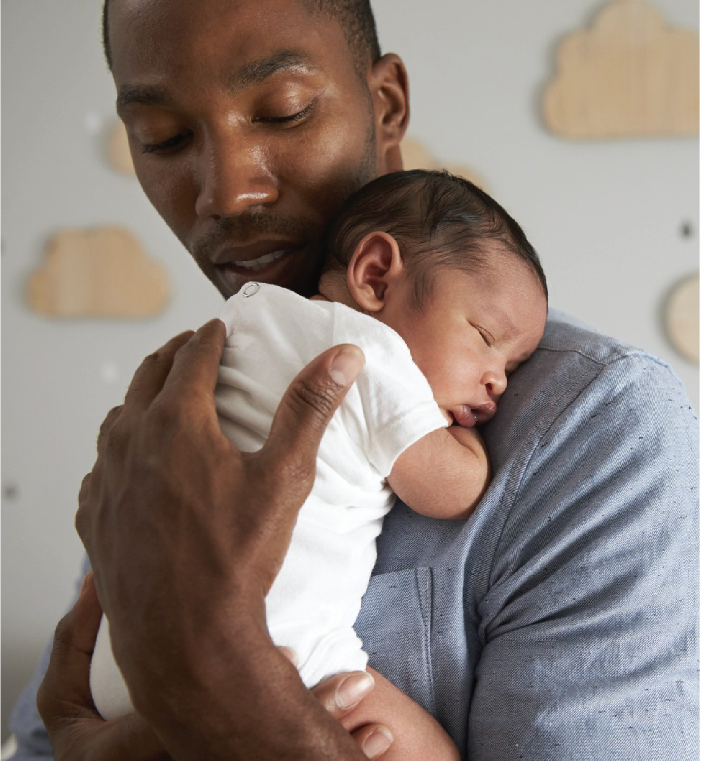 Father holding newborn child